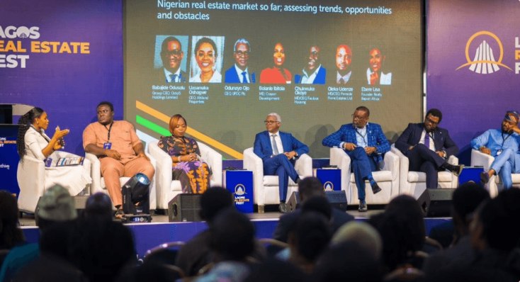 Ebere Lisa on stage with real estate leaders at Lagos Real Estate Fest